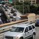 Traffic moves along the Brooklyn-Queens Expressway and the entrance to the Brooklyn Bridge, August 2, 2018 in New York City. On Thursday, the Trump administration announced a proposal to weaken fuel-efficiency requirements for the nation’s cars and trucks. The rollback is likely to spark legal challenges from California and other states